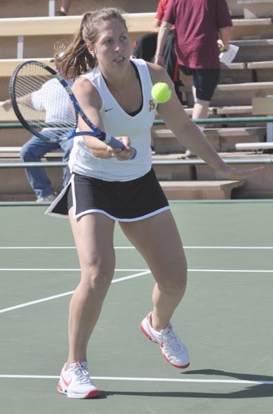 Bouncing Back: ASU senior Kelcy McKenna returns a shot near the net against Pacific on Feb. 13. McKenna and junior Michelle Brycki both returned to the Sun Devil lineup to help defeat Washington State and Oregon, the team’s first Pac-10 wins of the season. (Photo by Sierra Smith)