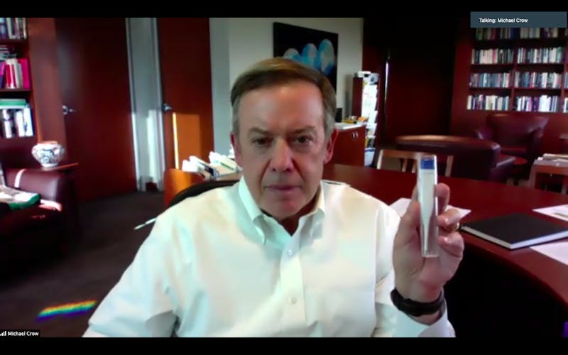 ASU President Michael Crow displays a thermometer referencing how new rapid test devices would be used during an interview with The State Press over Zoom on Wednesday, Sept. 23, 2020.&nbsp;