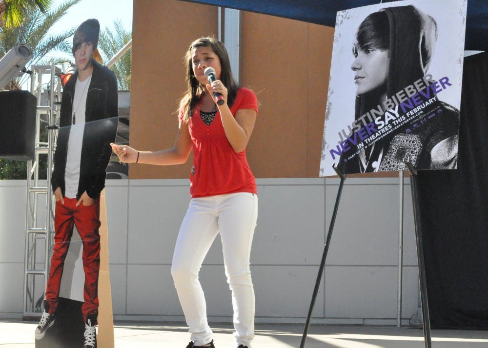 Kiana Brown, 13, spent nine hours at Tempe Marketplace on Saturday for a 60-second shot at winning tickets to Justin Bieber's movie premiere in Los Angeles. Her snappy rendition of "Baby" led her to victory over the other 49 teens. Photo by Lauren Jordan. 