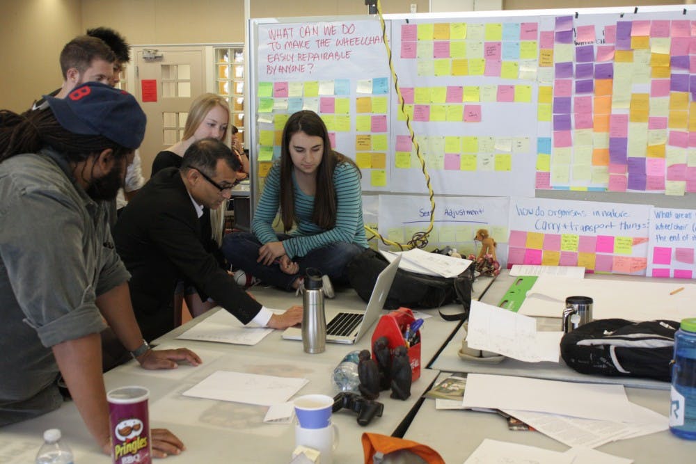 InnovationSpace team working on a project. From the left Mark Small, Edmund Jolley, Mike Chhay, Michelle Jack and Jenna Stevens working with Prasad Boradkar in the class. Photo by Mary Kivioja and Prasad Boradkar. 