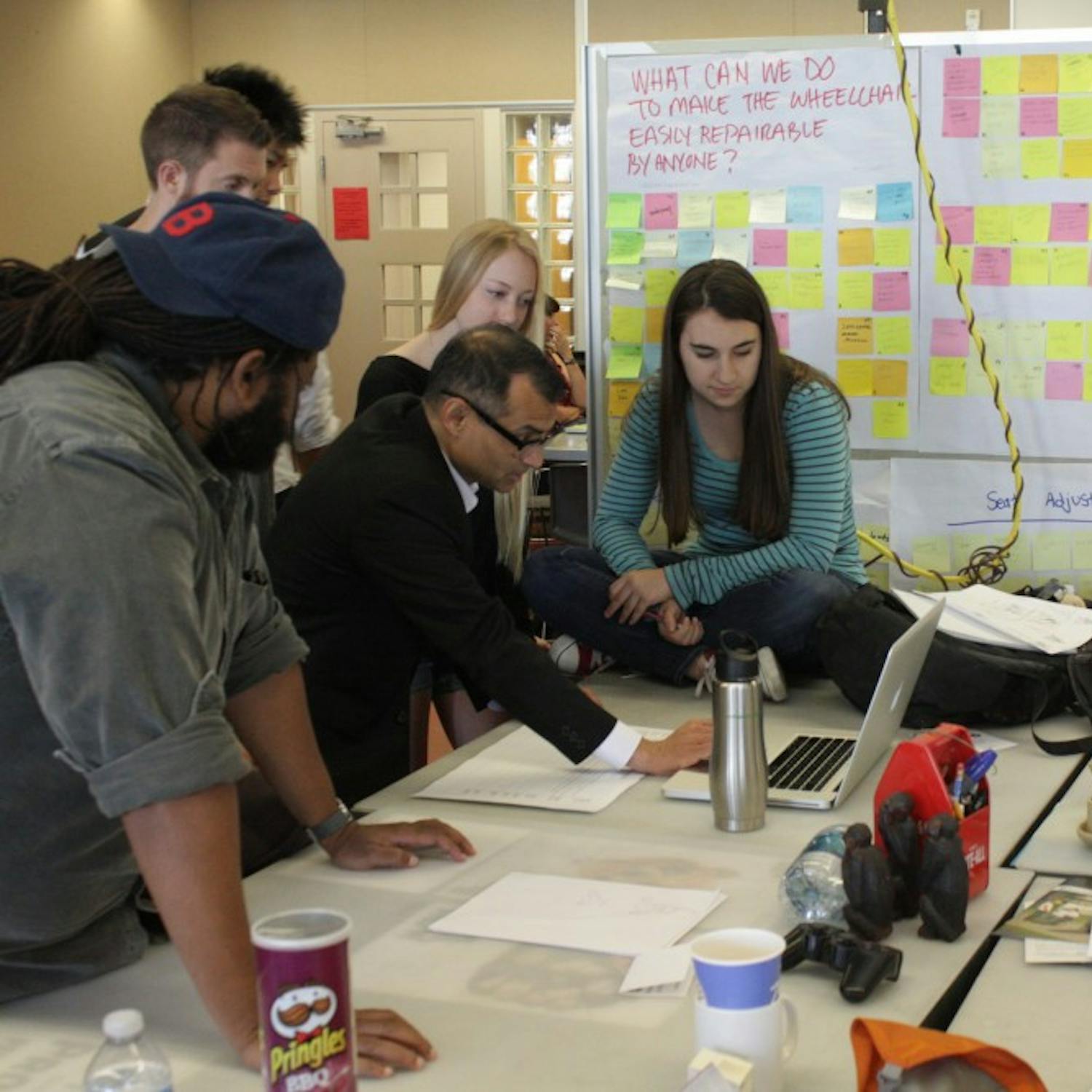 InnovationSpace team working on a project. From the left Mark Small, Edmund Jolley, Mike Chhay, Michelle Jack and Jenna Stevens working with Prasad Boradkar in the class. Photo by Mary Kivioja and Prasad Boradkar.
