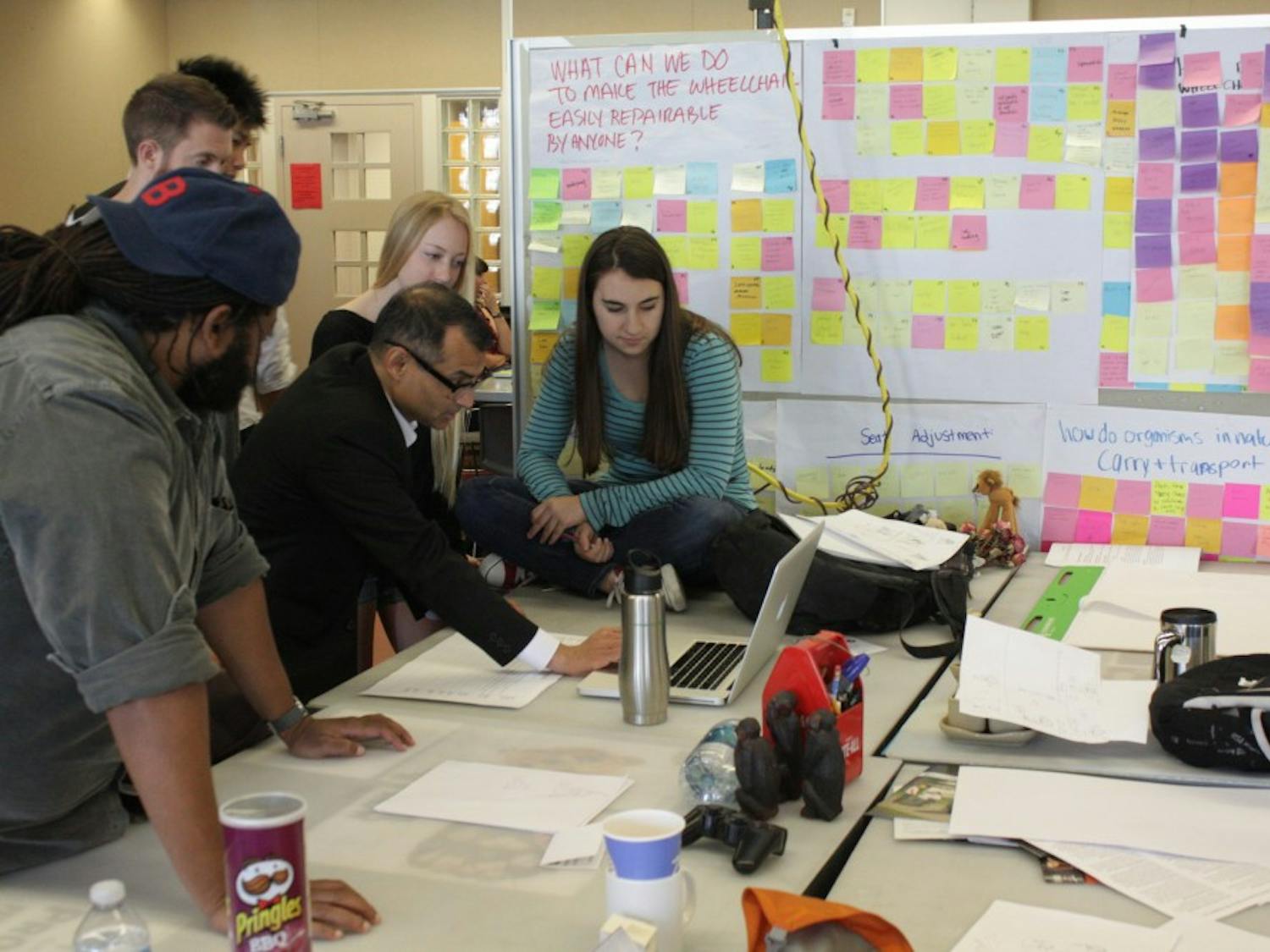 InnovationSpace team working on a project. From the left Mark Small, Edmund Jolley, Mike Chhay, Michelle Jack and Jenna Stevens working with Prasad Boradkar in the class. Photo by Mary Kivioja and Prasad Boradkar.