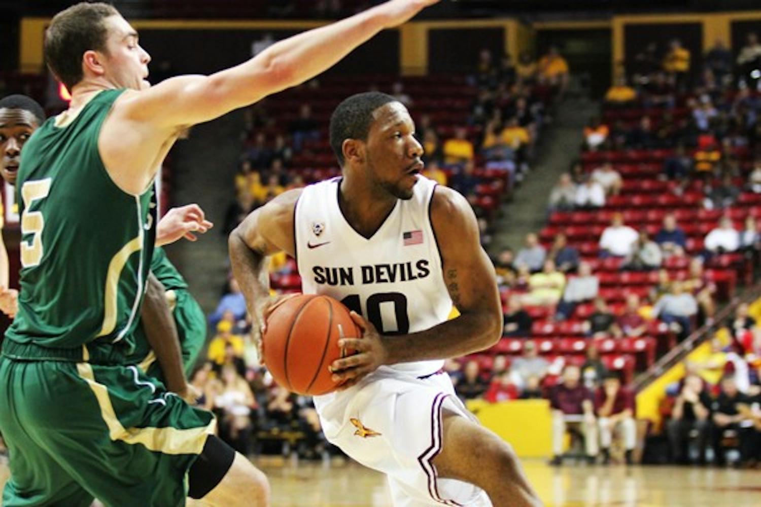 Junior guard Evan Gordon looks to the corner while driving to the basket in ASU’s 90-70 victory over Sacramento State on Dec. 1. (Photo by Kyle Newman)