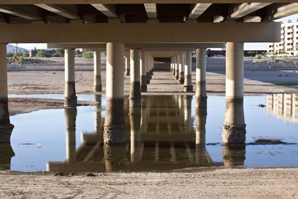 ANOTHER DOOR OPENS: Though the Tempe Town Lake dam broke at the end of July, there may be some good that comes out of it. Plans for the first Pedestrian Bridge will begin this year, and the bridge is scheduled to open in May 2011. Photo by Annie Wechter)