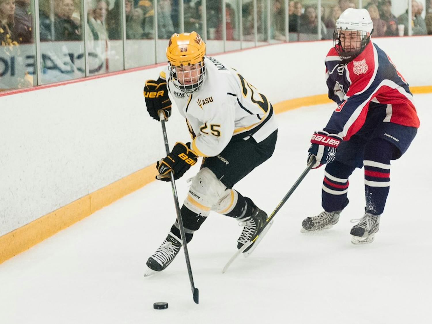 Senior forward Liam Norris skates with the puck in a game against Arizona on Saturday, Jan. 31, 2015, at Oceanside Ice Arena in Tempe. The Sun Devils defeated the Wildcats 7-2.