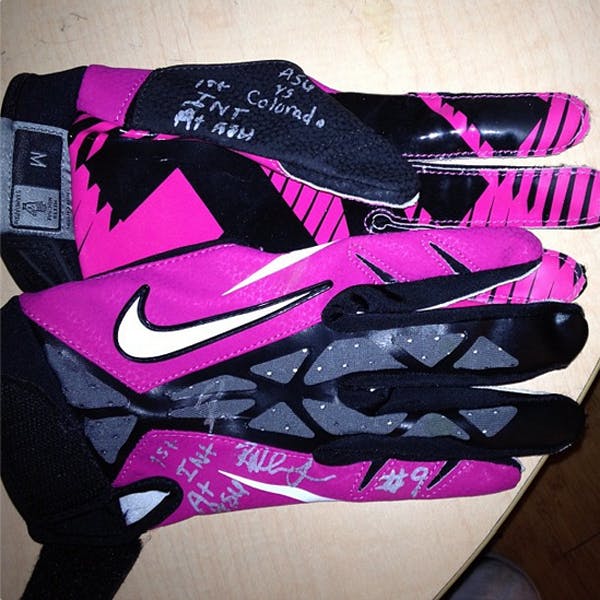 Redshirt junior defensive back Robert Nelson gave his pink gloves from his first interception against Colorado to his mother, Carlene, in honor of her struggle to defeat breast cancer. (Photo courtesy of Robert Nelson)
