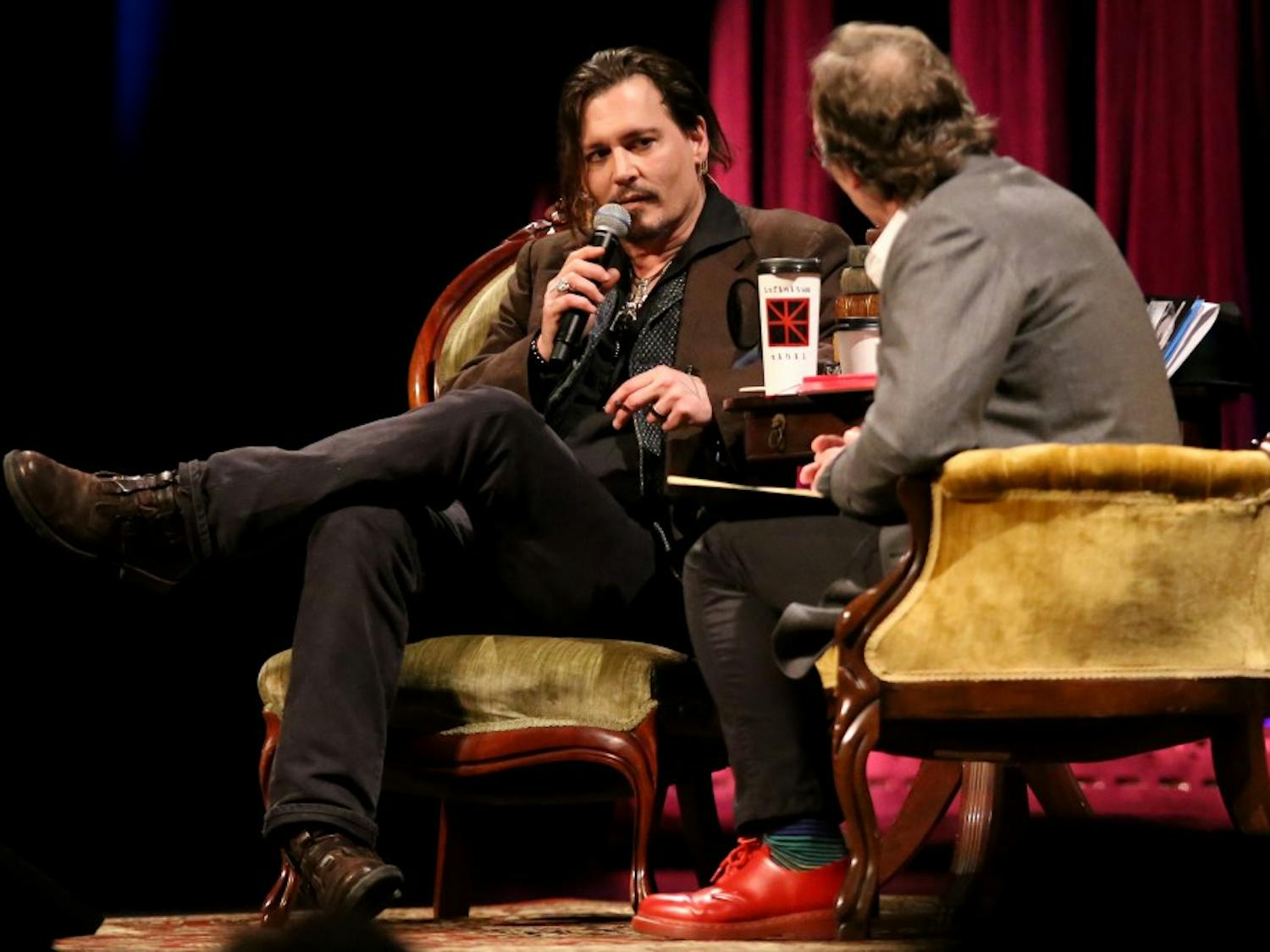 Johnny Depp speaks with Professor Lawrence Krauss during his talk 'Finding Creativity in Madness' at ASU Gammage on Saturday, March 12, 2016, as a part of the Origins Project. Lawrence 