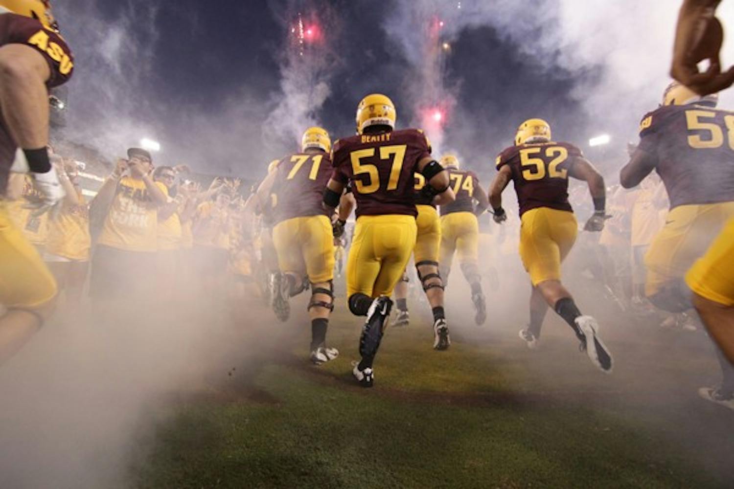IT'S TIME: The ASU Sun Devils take the field before Thursday night's game against UC Davis.  The Sun Devils came out on top 48-14. (Photo by Beth Easterbrook)