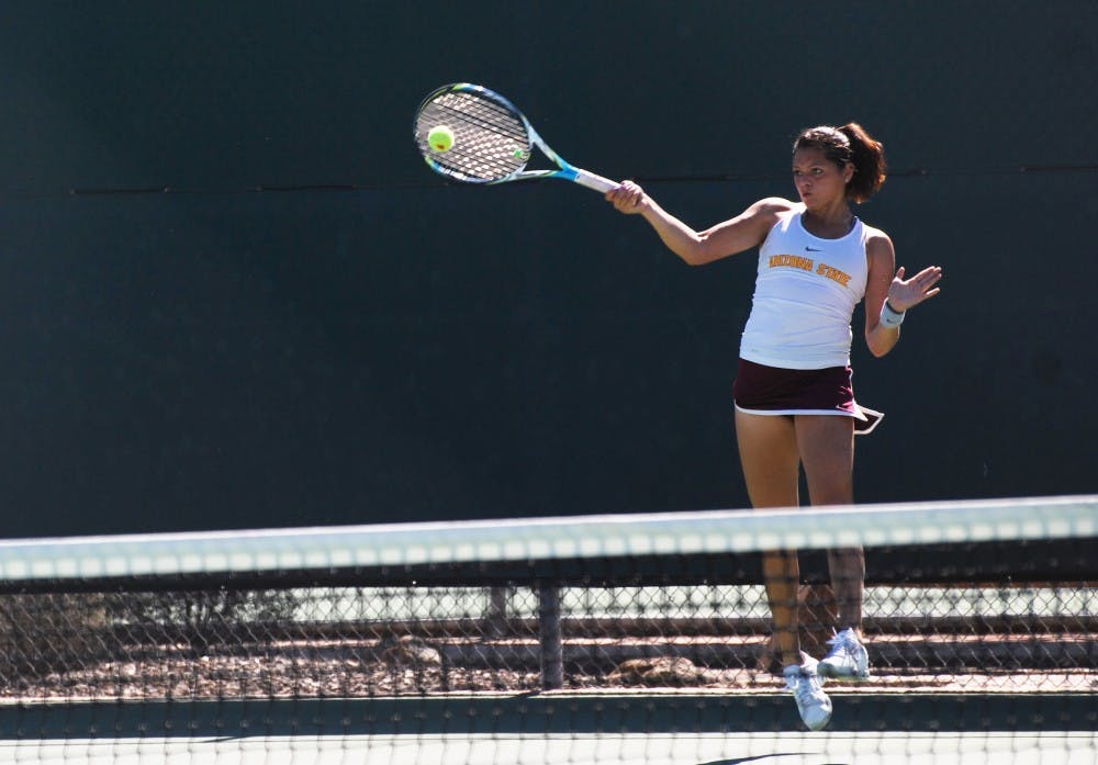 Sophomore Leighann Sahagun jumps to return a shot against Santa Clara on Feb. 17. The ASU tennis team was able to beat the Broncos in their closest contest of the season. (Photo by Murphy Bannerman)