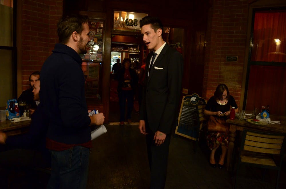 Producer Ryan Casey chats with actor and friend David Mayorga at the At Dusk after-party at The Rose and Crown Pub Nov. 20. Photo by Heather Hudzinski.&nbsp;