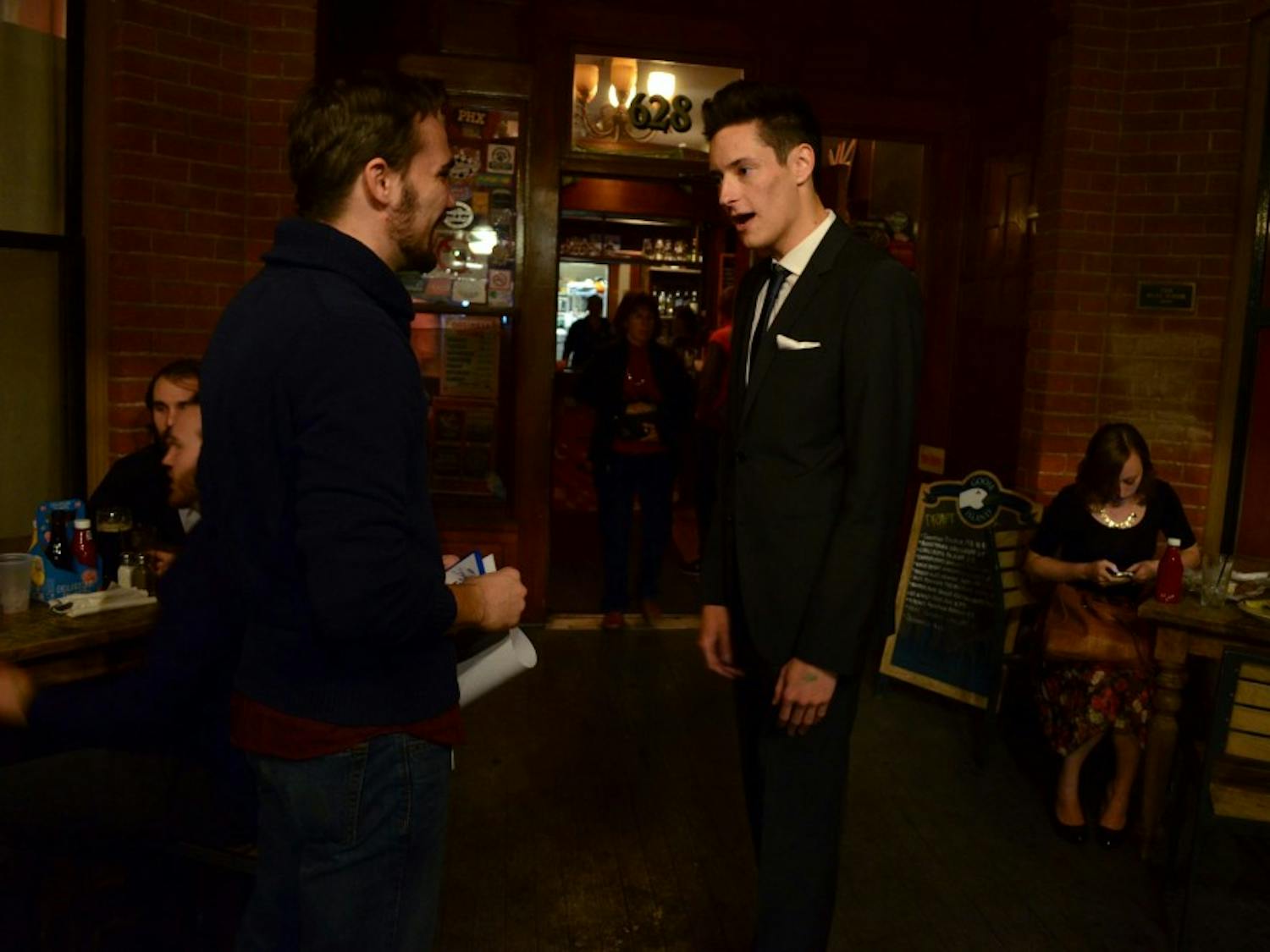 Producer Ryan Casey chats with actor and friend David Mayorga at the At Dusk after-party at The Rose and Crown Pub Nov. 20. Photo by Heather Hudzinski.&nbsp;