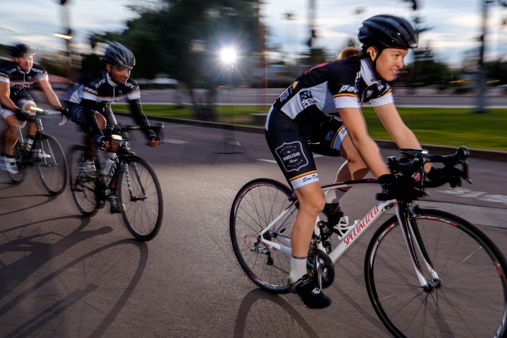 Sarah ___ leads the pack during a practice session on Jan. 28, 2015 in front of Gammage Auditorium. The ASU cycling team will compete at a race on Feb. 8, 2015 in front of Gammage Auditorium. (Andrew Ybanez/The State Press)