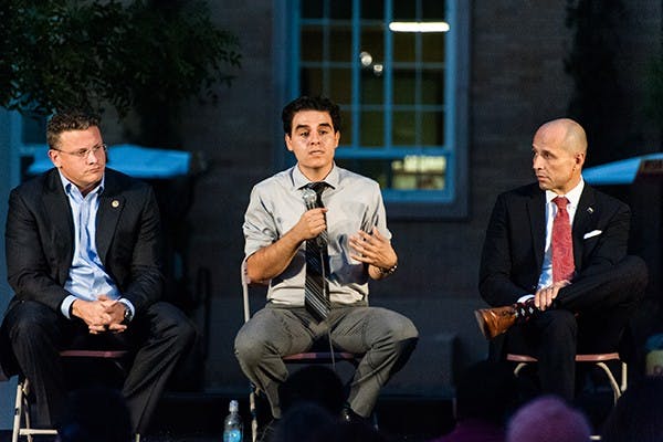State representative Juan Mendez (center) speaks to students on the last day of Sparking Democracy, Thursday, Oct. 30, 2014 on Hayden Lawn in Tempe. Undergraduate Student Government sponsored the event to give students a chance to learn about the candidates in the upcoming state election. (Photo by Ben Moffat)