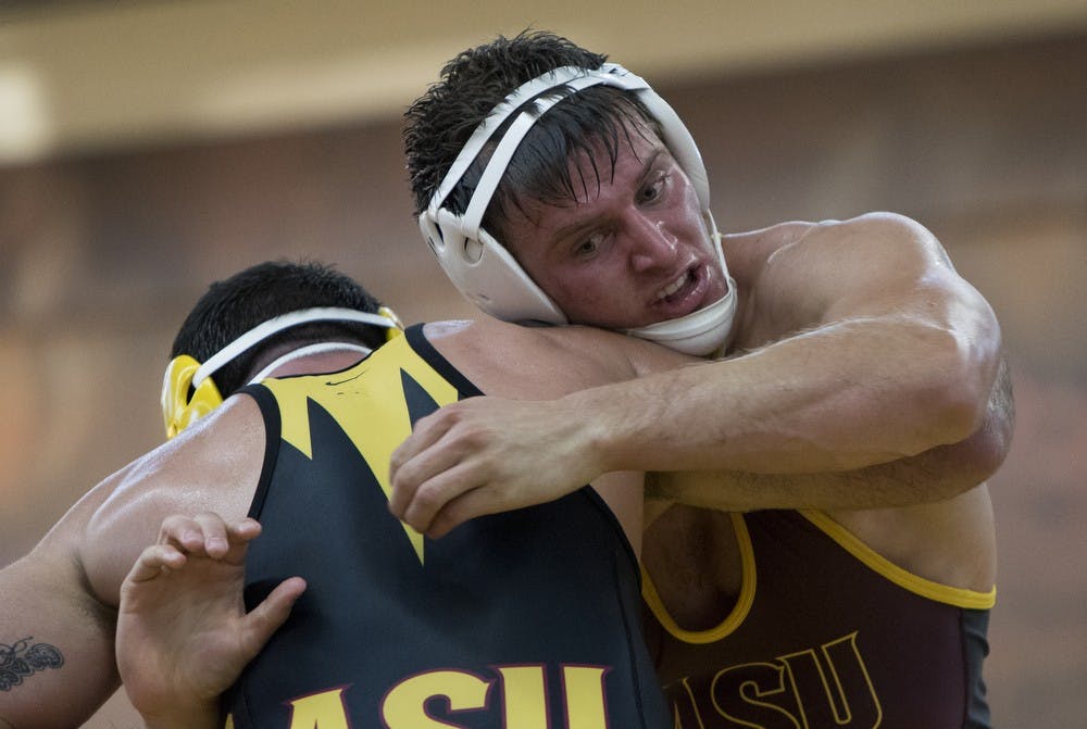 Junior Wes Moore competes against redshirt senior Josh DeSilveira during an intrasquad match on Friday, Oct. 30, 2015, at Ritches Wrestling Complex in Tempe. DeSilveira defeated Moore 3-1.