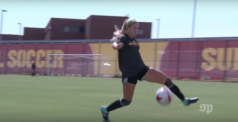 ASU soccer player chases ball