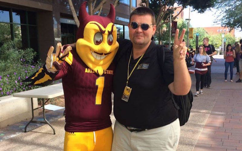 ASU public service senior James Deibler poses for a photo with Sparky the Sun Devil on ASU's downtown campus on Tuesday, Oct. 18, 2016.