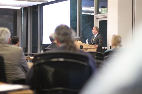 TRANSPORTATION ANSWERS: Phoenix Metro EO Steve Banta answers questions from the attendees of the meeting at the Transportation Office in Tempe on Tuesday night.  (Photo by Nikolai de Vera)