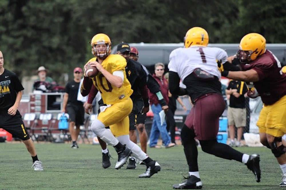 Redshirt senior quarterback Taylor Kelly looks for a receiver during a practice at Camp Tontozona 2014. (Photo by Andrew Ybanez)