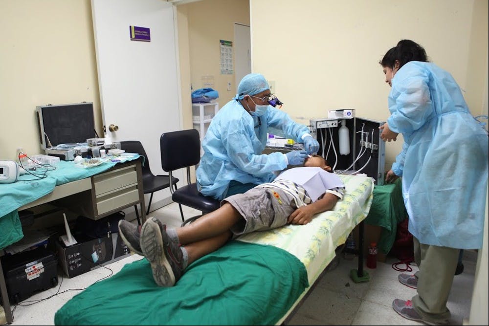 A repurposed massage table served as a dental station for an Engineering Projects in Community Service clinic in El Salvador in August 2014.