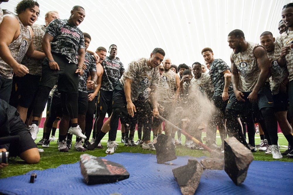Football summer D.J. Foster break the rock
