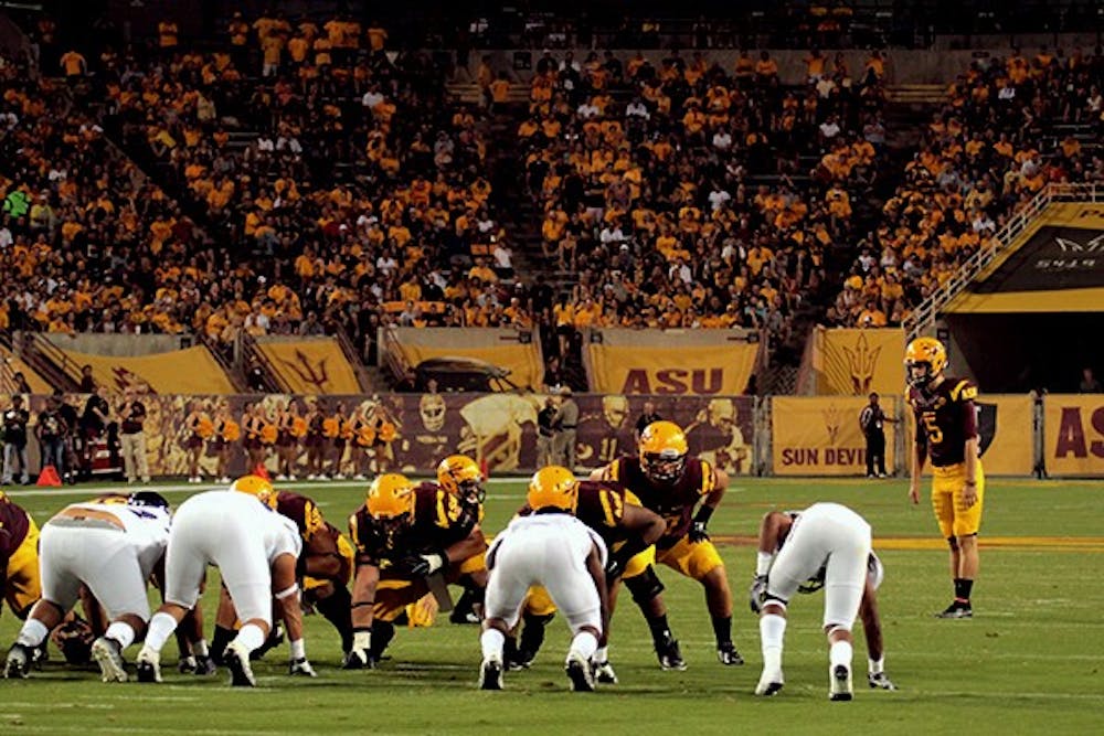 Sophomore place kicker Zane Gonzalez prepares to kick a field goal at a home game against Weber State on Aug. 28, 2014. (Photo by Alexis Macklin)