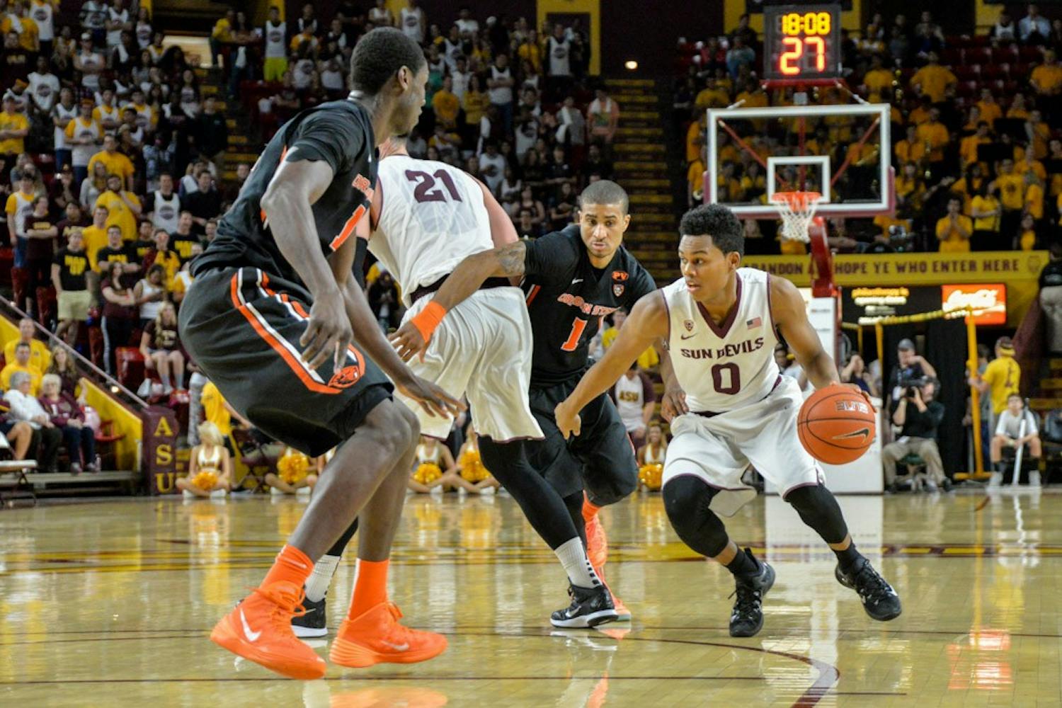 Freshman guard Tra Holder takes on the Oregon State Beavers defense on Wednesday, Jan. 28, 2015, at Wells Fargo Arena. The Sun Devils went on to win the game against OSU. (J. Bauer-Leffler/The State Press)