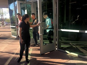 Students perform random acts of kindness on ASU's Downtown Phoenix, Arizona&nbsp;campus by holding the door open for each other on Wednesday, Feb. 16, 2017.