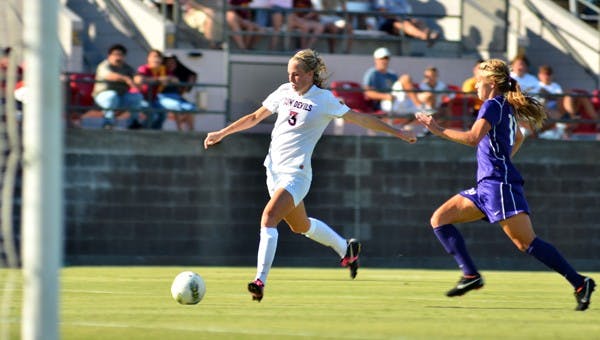 SAVING THE DAY: ASU senior forward Sierra Cook winds up for the game-winning goal during the Sun Devils’ win over Washington on Sunday. Cook’s tally gave ASU a victory on the last home game of the season. (Photo by Aaron Lavinsky)