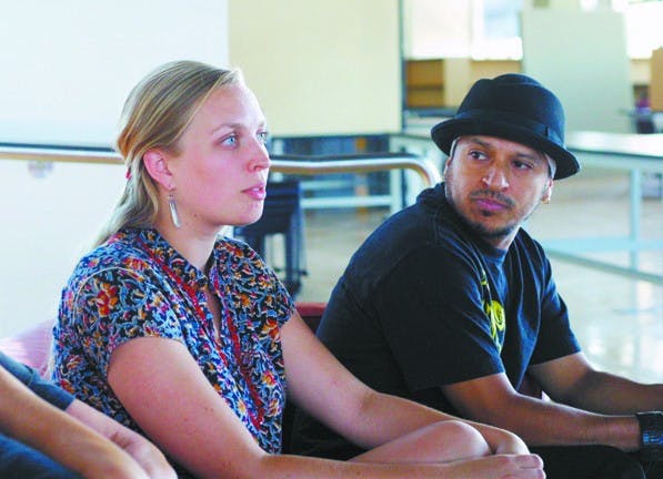 FREE STYLE: Alexandra Ostasiewicz, early childhood and youth coordinator for the International Rescue Committee, discusses the Herberger School of Arts' involvement in a dance program available for refugees in high school. Dance instructor Jorge Magana looks on. (Serwaa Adu-Tutu) 