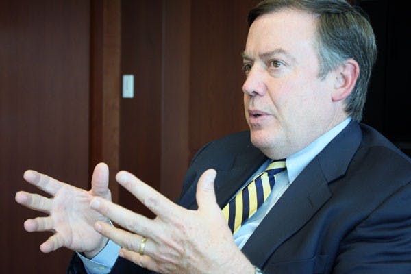 ASU President Michael Crow speaks to the editorial staff of The State Press. Crow held a Q&A session Dec. 10 at Verde Dining Pavilion on the West campus where students were able to openly ask questions. The discussion covered many topics, two primary subjects being diversity and Greek life. (Photo by Jessie Wardarski)