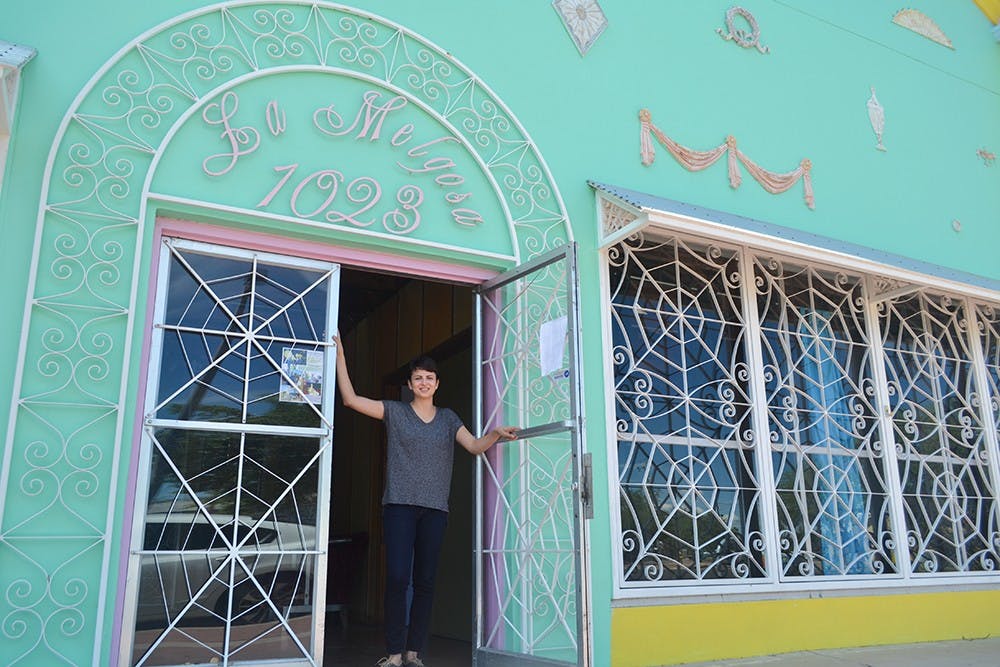 Rosie Magana stands in the entrance of her new Palabras bookstore in downtown Phoenix on Sunday, Sept. 6, 2015.