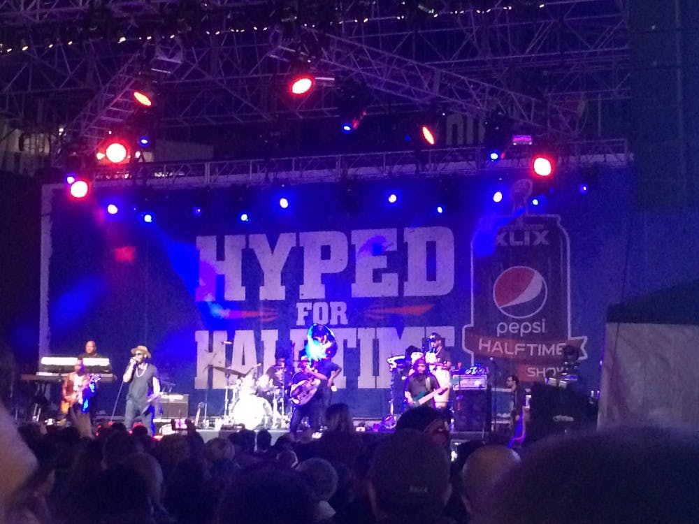 The crowd cheers on The Roots as they perform at the Hyped for Halftime in downtown Phoenix on Saturday, Jan. 31, 2015. (Zackary Moran/The State Press)
