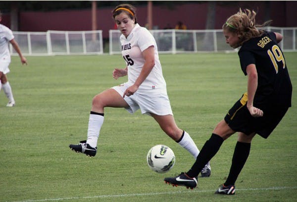 RUN THROUGH: ASU sophomore midfielder Holland Crook moves into the way of Missouri junior midfielder Jessica Greer to deflect her kick during Sunday’s game. Missouri handed ASU its first non-conference home loss since 2008. (Photo by Rosie Gochnour)