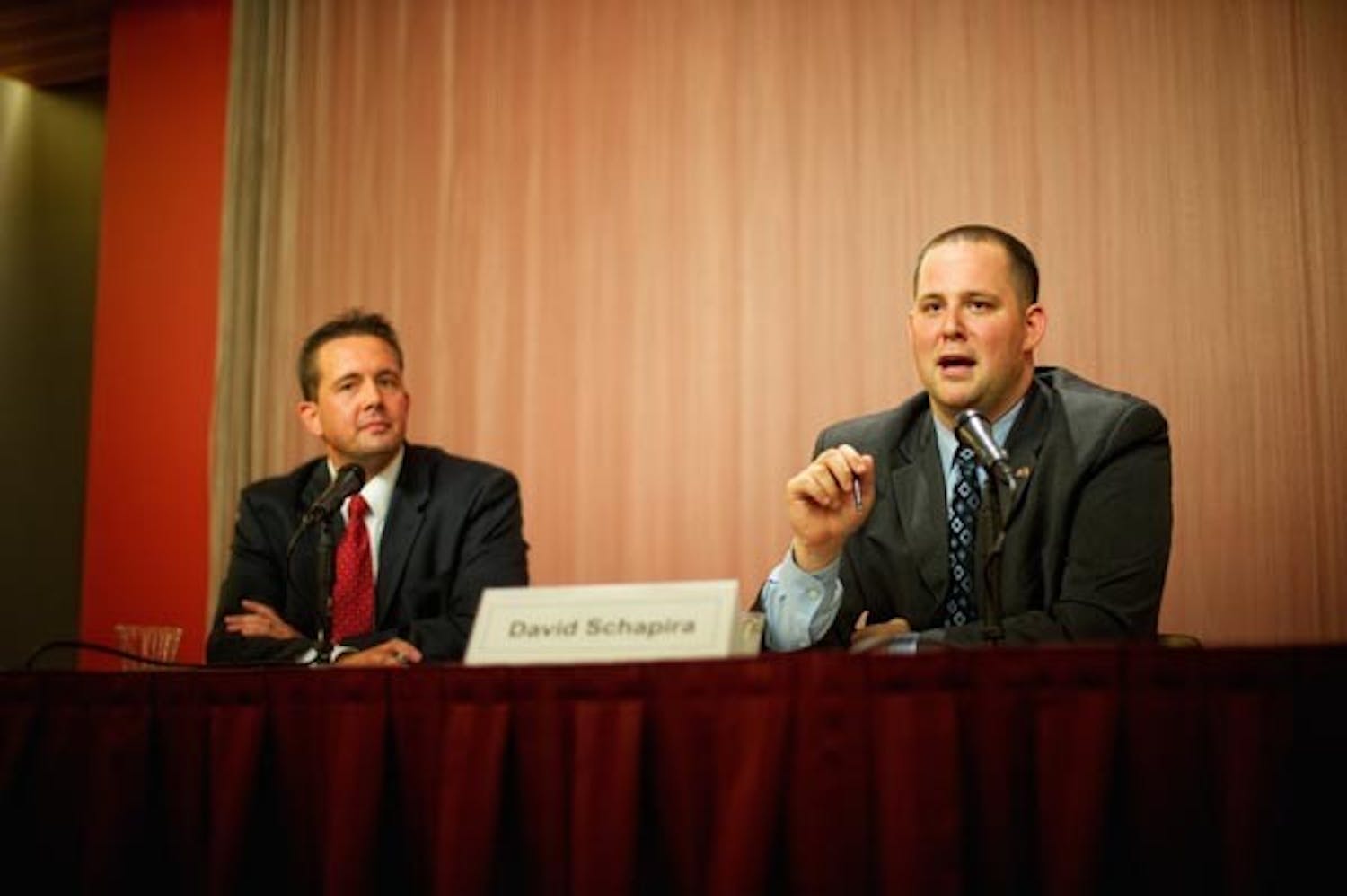 EMPTY DEBATE: David Shapira responds to a question submitted by the audience as the moderator looks on at the District 17 State Senate debate Wednesday night. His opponent, Wendy Rogers, failed to respond to requests to attend. (Photo by Michael Arellano)
