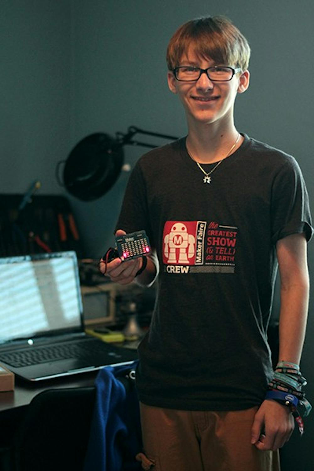 Joey Hudy, a 16-year-old Herberger Academy student, is the youngest person to get a job at Intel and will in the summer. He poses with his SMD LED Arduino shield, a creation he said he is proud of. (Photo by Alexis Macklin)
