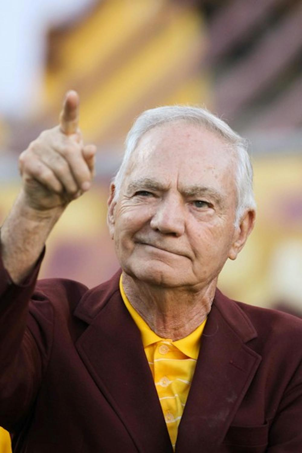 DUE CREDIT: Former ASU football coach Frank Kush points to the crowd before receiving the Lott IMPACT Award during halftime of the ASU-Colorado football game on Saturday. Kush was recognized with the lifetime achievement award for his success as a coach and his influence among his associates. (Photo by Lisa Bartoli)