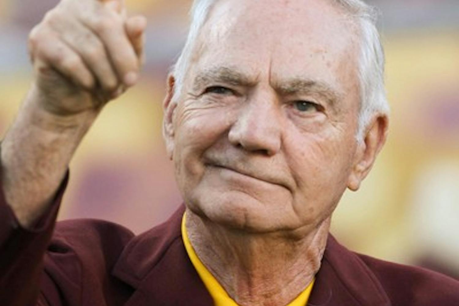 DUE CREDIT: Former ASU football coach Frank Kush points to the crowd before receiving the Lott IMPACT Award during halftime of the ASU-Colorado football game on Saturday. Kush was recognized with the lifetime achievement award for his success as a coach and his influence among his associates. (Photo by Lisa Bartoli)