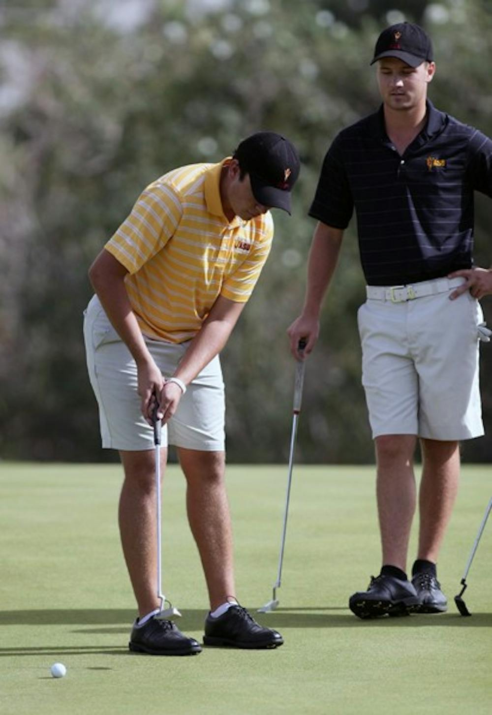 Freshman Cameron Palmer (left) practices putting with Mathias Schjoelberg (right) on Nov. 4, 2011. Palmer competed as an individual in the San Diego Intercollegiate Classic and was one of the few shining stars for the Sun Devils. (Photo by Beth Easterbrook)