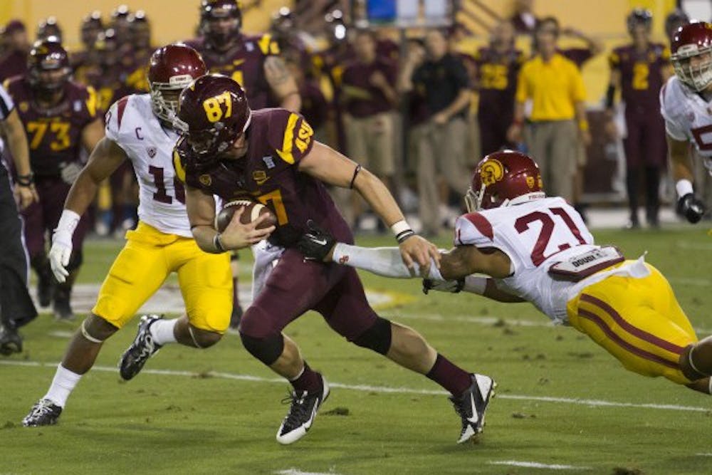 Graduate tight end Chris Coyle carries the ball for an ASU first down against USC at home Sep. 28 2013. The Sun Devils defeated USC 62-41. (Photo by Vince Dwyer) 