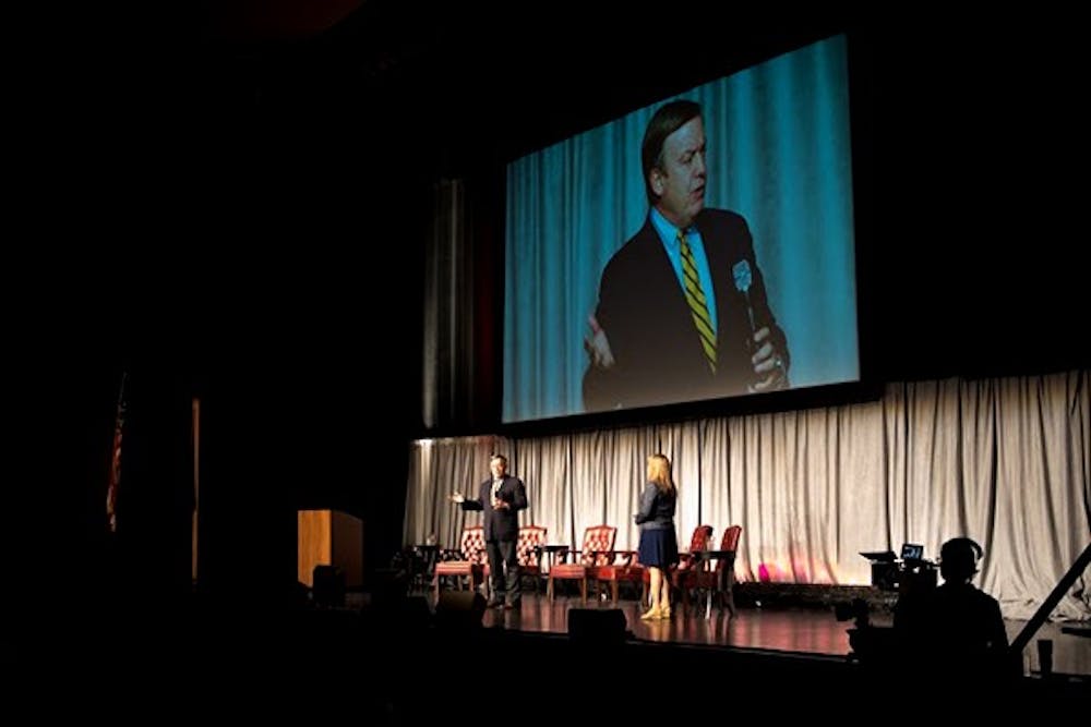 ASU President Dr. Michael Crow speaks to a crowd at Gammage Auditorium Feb. 19. about the changing roles of women in the world. (Photo by Andrew Ybanez) 
