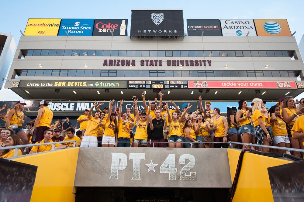 Students in the south Inferno section cheer before a game against Cal Poly on Saturday, Sept. 12, 2015, at Sun Devil Stadium in Tempe.