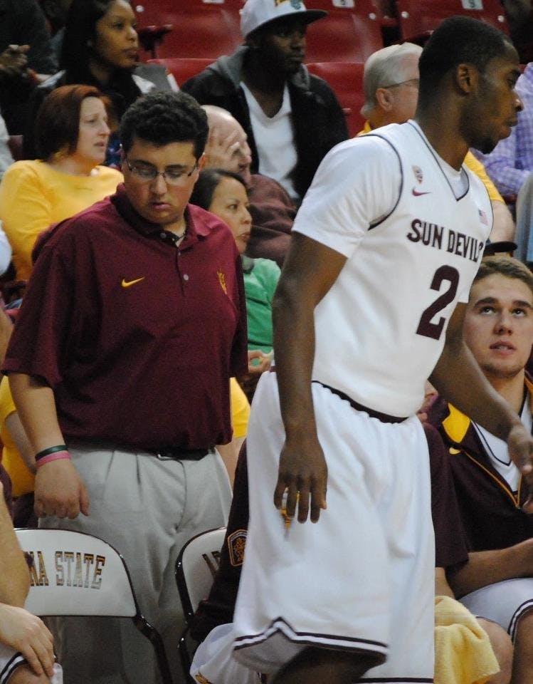 Antonio Cannavaro works behind the bench during the Arizona State vs. Arkansas Pine-Bluff game on November 28th, 2012. ASU won 67-54. Photo by Nick Krueger