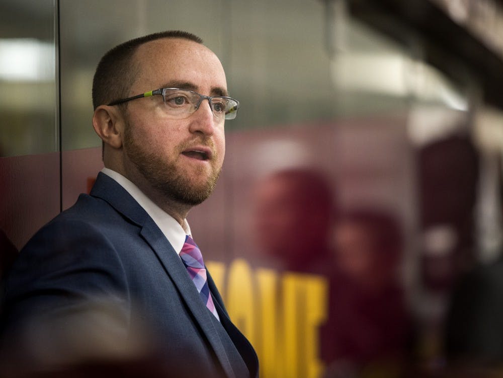 ASU hockey coach Greg Powers watches the Sun Devils play at the Oceanside Ice Arena in Tempe, Ariz. The Sun Devils led Southern New Hampshire 7-1 after the second period. 