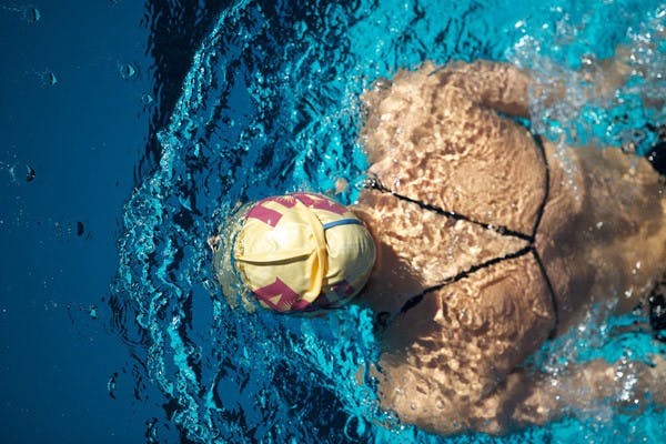 Final push: An ASU swimmer propels through the water during a practice in January. The women’s swim team closed out the season with high finishes in the 3-meter springboard and in the relays at the NCAA championships. (Photo by Sierra Smith)