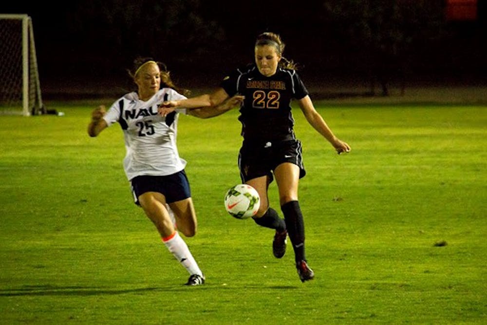 Freshman defender Madison Stark dribbles the ball upfield in a game against NAU on Aug. 15 in West campus.