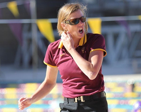 Swim coach Dorsey Tierney-Walker cheers on her team during the Sun Devils’ home opener against GCU and Washington State on Saturday. (Photo by Kyle Newman)