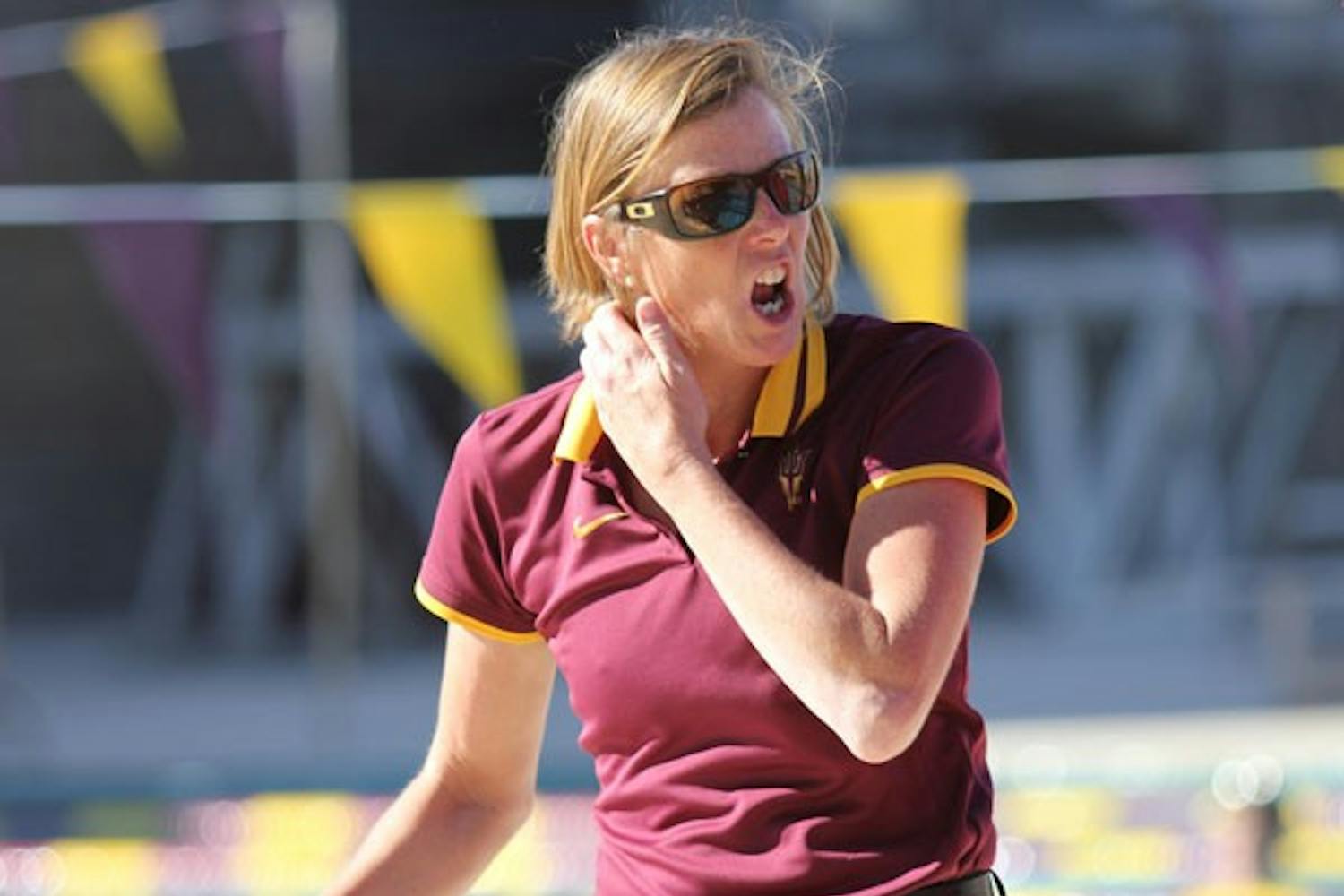 Swim coach Dorsey Tierney-Walker cheers on her team during the Sun Devils’ home opener against GCU and Washington State on Saturday. (Photo by Kyle Newman)