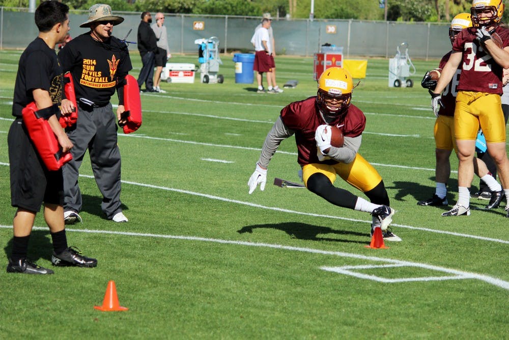 Junior running back D.J. Foster participates in drills at ASU football's first spring practice on March 18 at the Kajikawa Football Practice Fields in Tempe. (Photo by Evan Webeck)