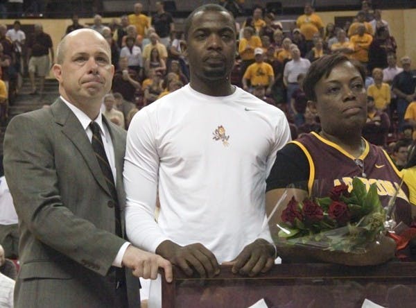 Bidding Farewell: ASU coach Herb Sendek (left) holds back the tears while standing next to Ty Abbott and his mother during senior introductions before the Sun Devils game against Oregon State Saturday. Abbott scored 22 points in his final regular season game. (Photo courtesy of Beth Easterbrook)