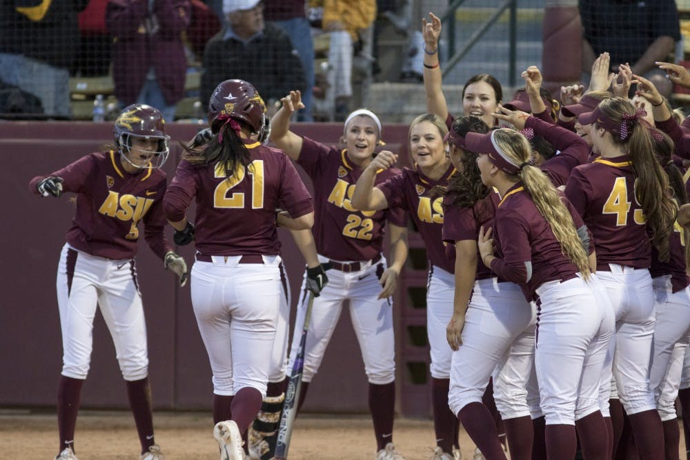 Senior Bethany Kemp hits a home run against University of Michigan at Farrington Stadium on Friday Feb. 27, 2015. (Jacob Stanek/State Press)